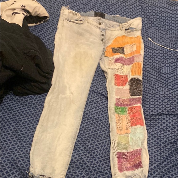 Relaxed Blue Jeans with Vibrant Patchwork Design